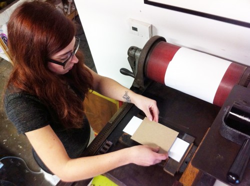 Photo of girl at small printing press