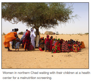 Women in northern Chad waiting with their children at a health center waiting for a nutrition screening
