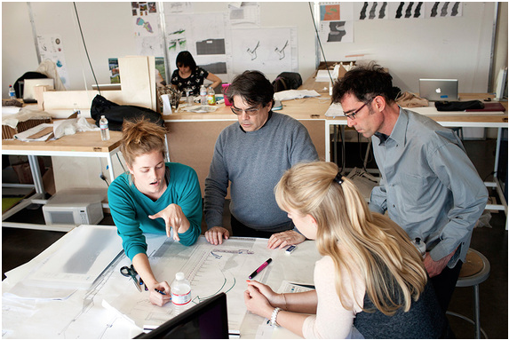 Photo of teacher working with students