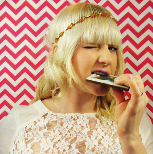 Photo of girl biting chocolate bar