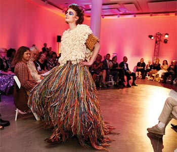 Girl in colorful skirt on fashion show runway